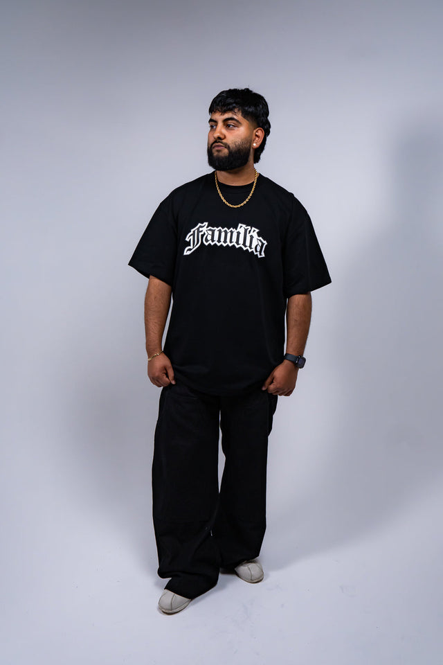 Familia graphic tee, Familia shirt, Mediums Collective tee, Latino streetwear, Mexican inspired clothing, family pride shirt, Gothic graphic tee, men’s streetwear shirt, Seattle streetwear brand, cultural streetwear, heritage graphic tee, pine green graphic tee, black Familia shirt, cream graphic tee, Latino fashion brand, Mexican American streetwear, family shirt, everyday graphic tee, men’s casual fashion.
