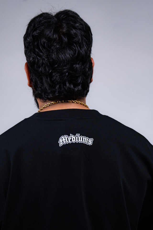 Familia graphic tee, Familia shirt, Mediums Collective tee, Latino streetwear, Mexican inspired clothing, family pride shirt, Gothic graphic tee, men’s streetwear shirt, Seattle streetwear brand, cultural streetwear, heritage graphic tee, pine green graphic tee, black Familia shirt, cream graphic tee, Latino fashion brand, Mexican American streetwear, family shirt, everyday graphic tee, men’s casual fashion.