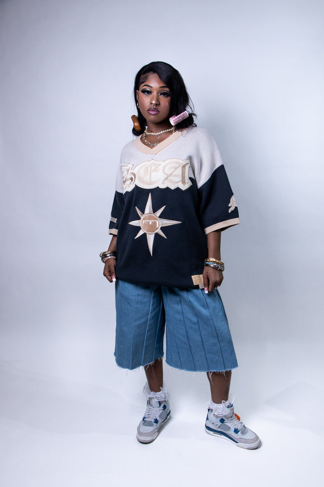 Model wearing a beige and navy Mediums Collective SEA 206 Knit V neck sports jersey with a SEA Velour embroidery design on a white background, Model wearing a beige and blue Mediums Collective Seattle 206 Knit V neck sports jersey with a SEA Velour embroidery design on a white background, MLB, mariners, Seattle v-neck, streetwear, sports knit jersey