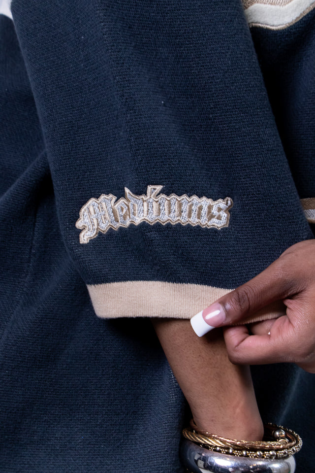 Model wearing a beige and navy Mediums Collective SEA 206 Knit V neck sports jersey with a SEA Velour embroidery design on a white background, Model wearing a beige and blue Mediums Collective Seattle 206 Knit V neck sports jersey with a SEA Velour embroidery design on a white background, MLB, mariners, Seattle v-neck, streetwear, sports knit jersey