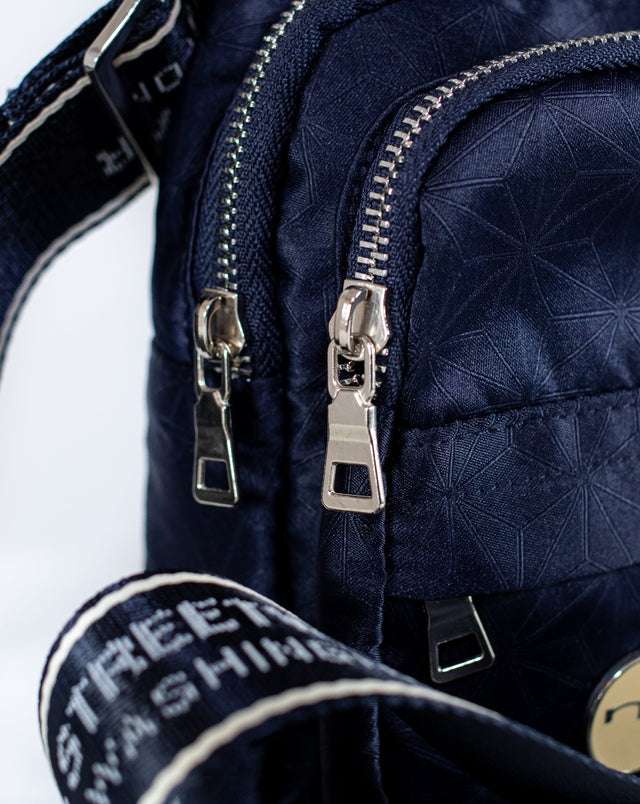 The Mediums Collective mini is a super convenient, lightweight, and comfortable bag, meant for carrying you personal goods. It features our custom 22 collection fabric, an adjustable nylon belt for premium comfort on the shoulders, and multiple compartments for extra items. This is the bag that completes the fill fit.