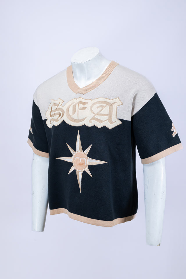 Mannequin wearing a beige and navy Mediums Collective SEA 206 Knit V neck sports jersey with a SEA Velour embroidery design on a white background, Model wearing a beige and blue Mediums Collective Seattle 206 Knit V neck sports jersey with a SEA Velour embroidery design on a white background, MLB, mariners, Seattle v-neck, streetwear, sports knit jersey