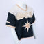 Mannequin wearing a beige and navy Mediums Collective SEA 206 Knit V neck sports jersey with a SEA Velour embroidery design on a white background. MLB, mariners merch, 90's, near me