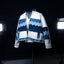 Blue and white patterned jacket on a mannequin against a dark background