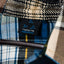Plaid fabric with a visible Mediums collective brand label on a hanger
