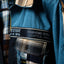 Blue jacket with plaid pattern and 'High-End Street' label on a dark background