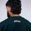 Familia graphic tee, Familia shirt, Mediums Collective tee, Latino streetwear, Mexican inspired clothing, family pride shirt, Gothic graphic tee, men’s streetwear shirt, Seattle streetwear brand, cultural streetwear, heritage graphic tee, pine green graphic tee, black Familia shirt, cream graphic tee, Latino fashion brand, Mexican American streetwear, family shirt, everyday graphic tee, men’s casual fashion.